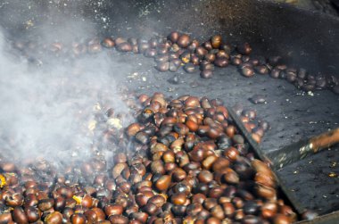 roasted chestnuts cooked on the grill in autumn
