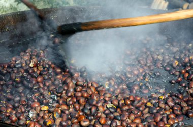 roasted chestnuts cooked on the grill in autumn