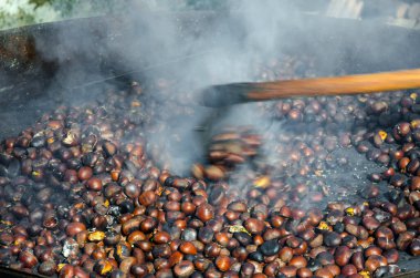 roasted chestnuts cooked on the grill in autumn