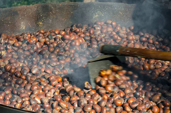 roasted chestnuts cooked on the grill in autumn