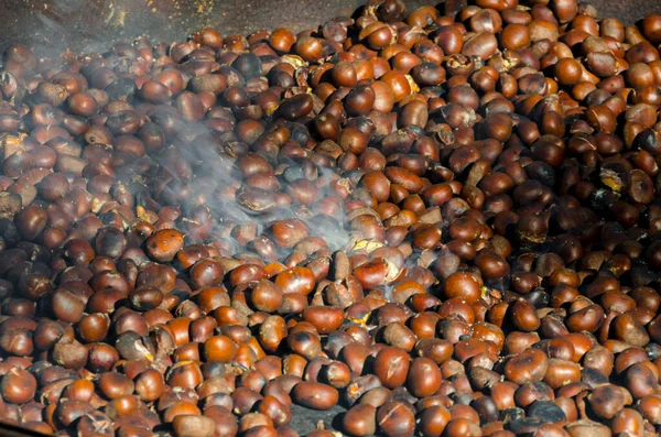roasted chestnuts cooked on the grill in autumn