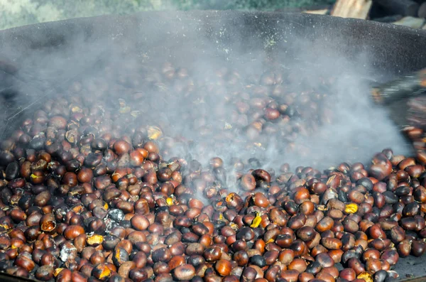 roasted chestnuts cooked on the grill in autumn