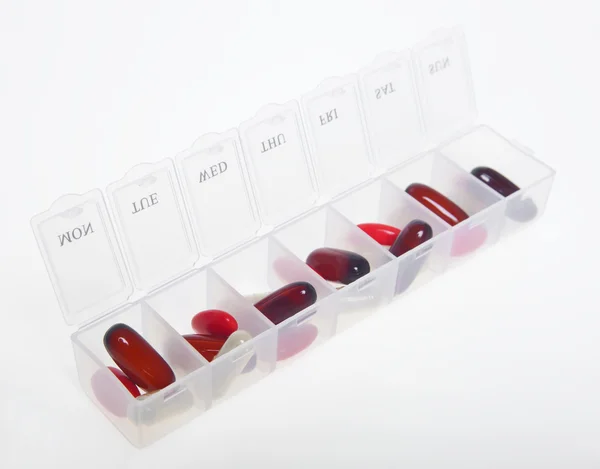 Caja de la píldora con variedad de pastillas — Foto de Stock
