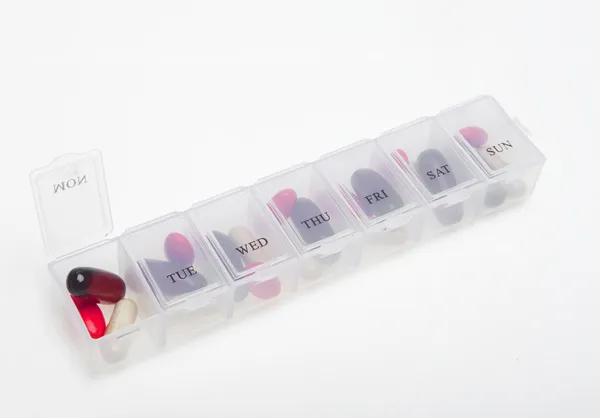 Pill box with variety of pills — Stock Photo, Image