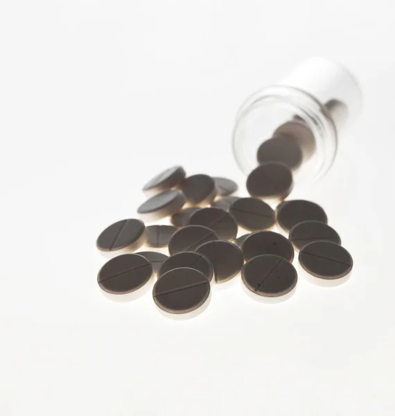 Cápsulas derramadas de garrafa de prescrição — Fotografia de Stock