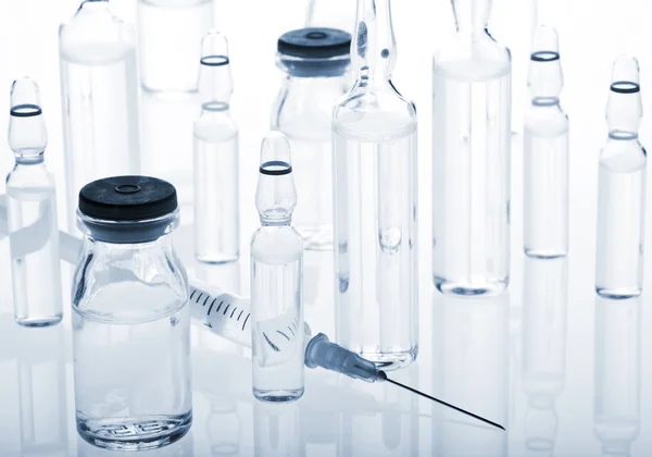 Glass Medicine Vials, Ampoules and Syringe — Stock Photo, Image