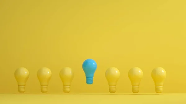 Blaue Lampen zwischen gelben Lampen auf gelbem Hintergrund. Führung, Innovation, großartige Ideen und Individualitätskonzepte. — Stockfoto