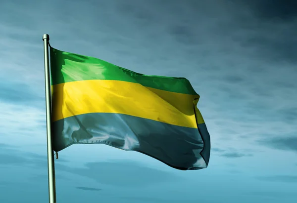 Gabon mávání vlajkami večer — Stock fotografie
