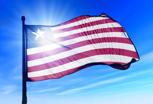 Liberia vlag zwaaien op de wind — Stockfoto