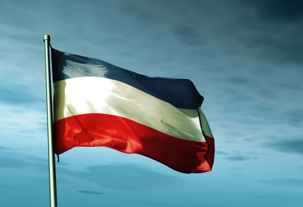 Sleeswijk-holstein (ger) vlag zwaaien op de wind — Stockfoto