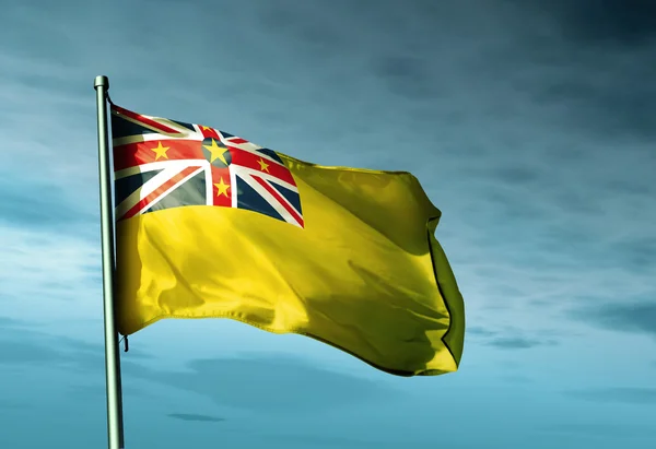 Niue ध्वज हवा पर लहर रहा है — स्टॉक फ़ोटो, इमेज