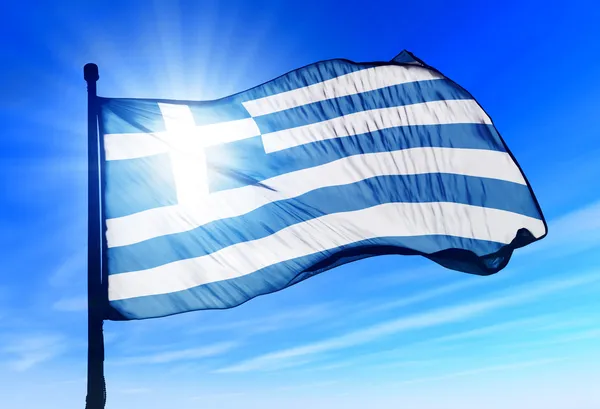 Bandera de Grecia ondeando en el viento Imágenes de stock libres de derechos