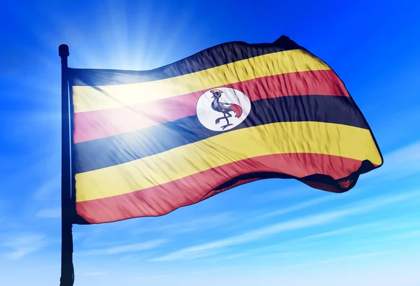 Уганда прапор махав на вітрі — стокове фото