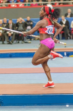 DONETSK,UKRAINE-FEB .09: Yarisley Silva - The silver prize-winner of Olympic Games 2012 in the pole vault runs with a pole in the hands clipart