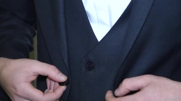 Man Fastens Button Jacket Close — стоковое видео