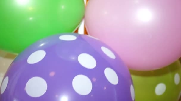 Multicolored baby balloons close up — ストック動画