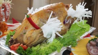 big baked turkey on a holiday table close up