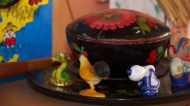 Traditional Ukrainian products from clay and wood. Painting absorbed tree