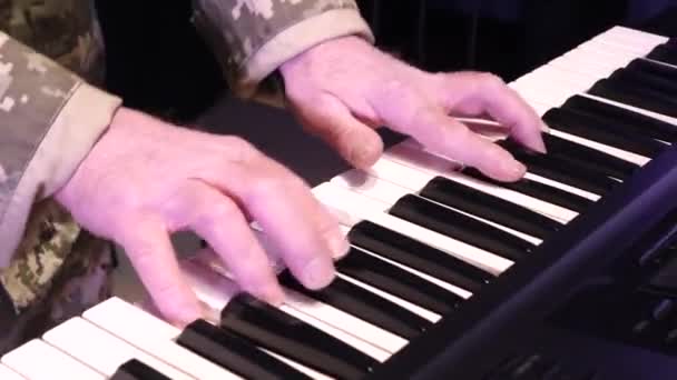 Ukrainian Military Man Plays Keyboard Instrument Hands Close — стоковое видео
