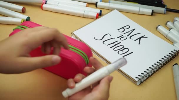 Back School Teenager Puts Various School Accessories Pencil Case — Stockvideo