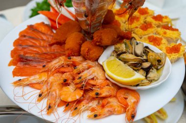 Red fish and boiled crayfish as an appetizer for beer.