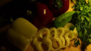 Transition for videos of red and green peppers and other vegetables.