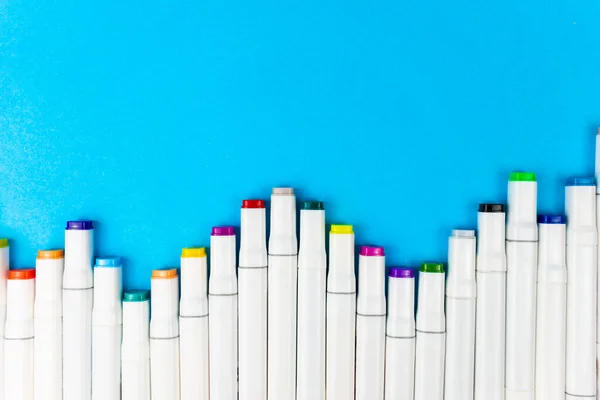 Many White Assorted Markers Stacked Blue Background Place Writing Copy — Stock Photo, Image