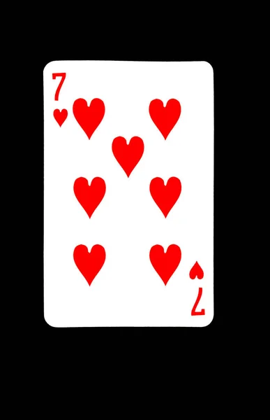 Siete de corazones jugando a las cartas sobre fondo negro —  Fotos de Stock