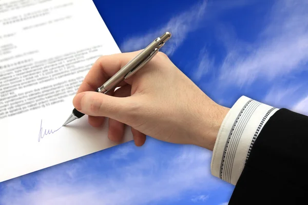 The Signature of Business Contract on the blue Sky