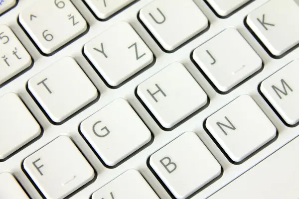 Detalhe do computador portátil branco da placa chave — Fotografia de Stock