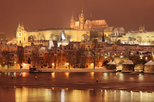 Night colorful snowy Prague gothic Castle with Charles Bridge — Stock Photo, Image