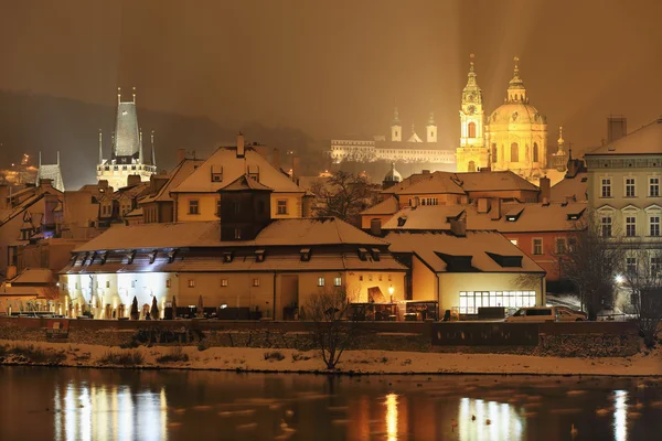 Night romantic snowy Prague St. Nicholas' Cathedral, Czech republic — Stock Photo, Image