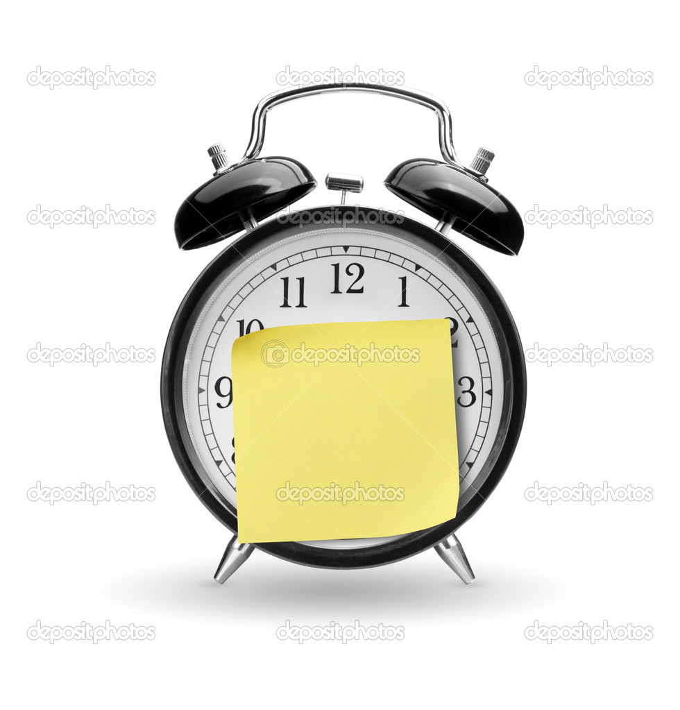 Alarm clock with yellow sticky paper isolated on white backgroun