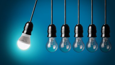 Idea concept on black. Perpetual motion with light bulbs clipart