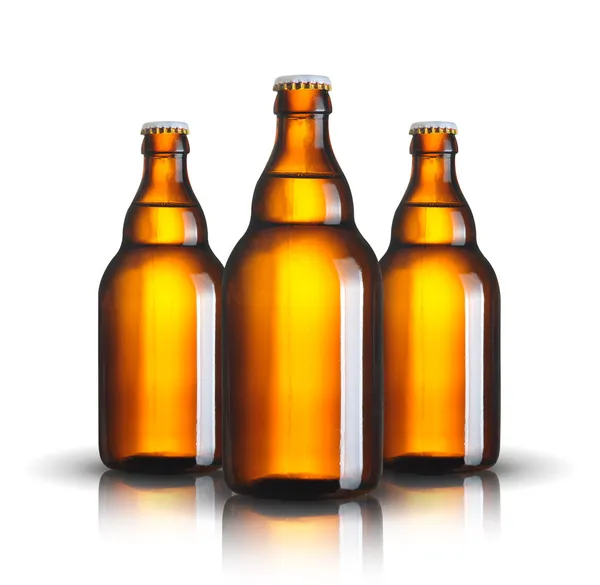 Три бутылки пива — стоковое фото