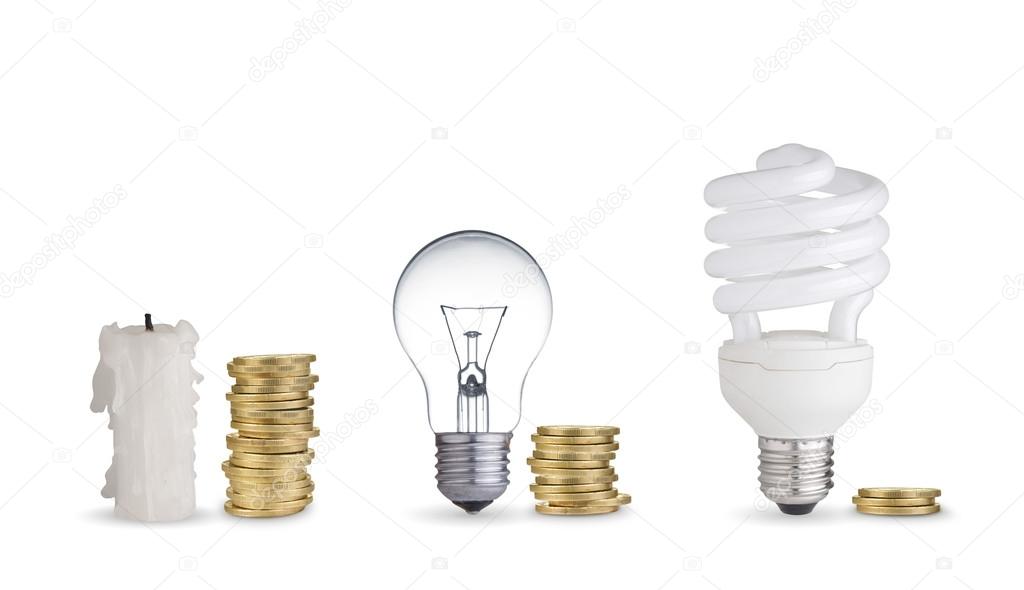 Coins, light bulbs and candle.Isolated on white
