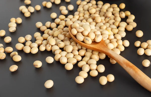 Soybeans Brown Wooden Spoon Several Seeds Which Black Background — 스톡 사진