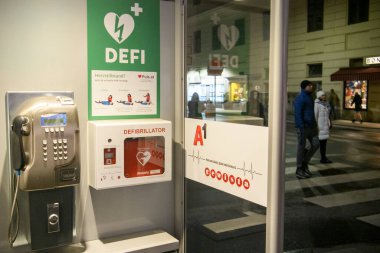 Wall mounted AED defibrillator in a public place in Vienna, Austria. January 2022 Automated External Defibrillator (AED) . High quality photo clipart