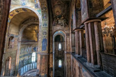 Interior of the St. Sophia Cathedral with mosaic Orans of Kyiv, frescoes on the wall and the golden altar. Kyiv, Ukraine, July 2022. High quality photo