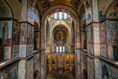 Interior of the St. Sophia Cathedral with mosaic Orans of Kyiv, frescoes on the wall and the golden altar. Kyiv, Ukraine, July 2022. High quality photo