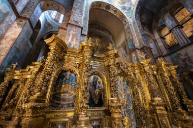 Interior of the St. Sophia Cathedral with mosaic Orans of Kyiv, frescoes on the wall and the golden altar. Kyiv, Ukraine, July 2022. High quality photo