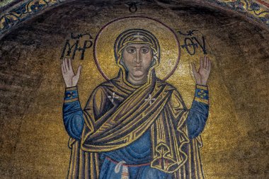 Interior of the St. Sophia Cathedral with mosaic Orans of Kyiv, frescoes on the wall and the golden altar. Kyiv, Ukraine, July 2022. High quality photo