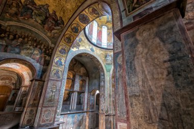 Interior of the St. Sophia Cathedral with mosaic, painting frescoes on the wall and the golden altar. Kyiv, Ukraine, July 2022. High quality photo