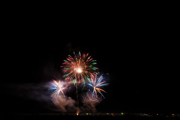 Colorful fireworks over night sky — Stock Photo, Image