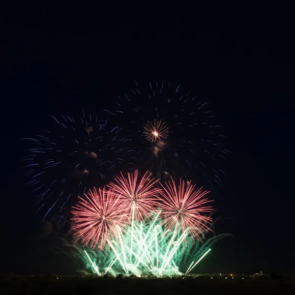 Colorful fireworks over night sky — Stock Photo, Image