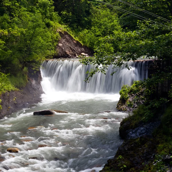 Waterfall in the river valley — Stock Photo, Image