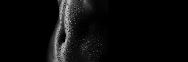 Sexy women's tummy in drops of sweat — Stock Photo, Image