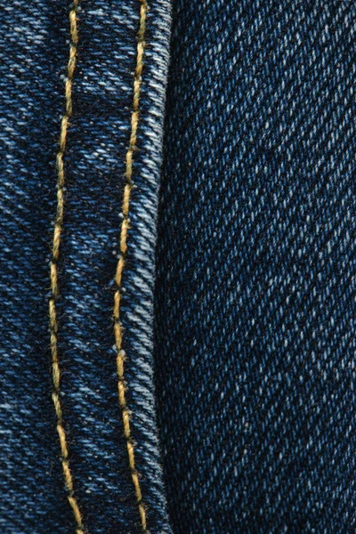 ジーンズの近くに縫い目 デニムにステッチ 青いジーンズの背景を閉じます デニムの質感 — ストック写真