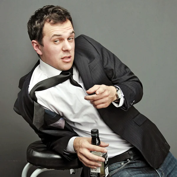 Drunk young man in office clothes — Stock Photo, Image