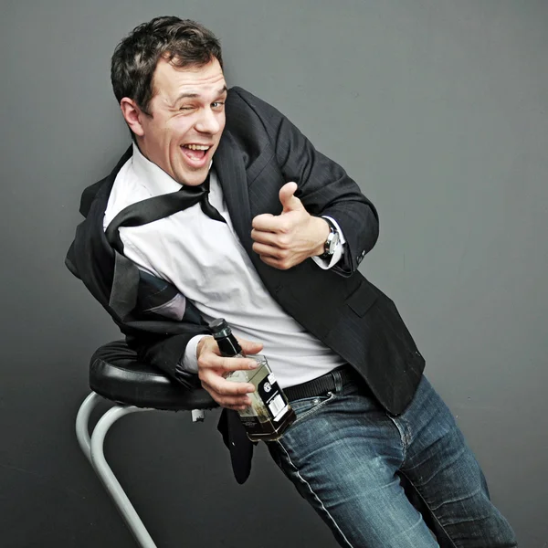 Drunk young man in office clothes — Stock Photo, Image